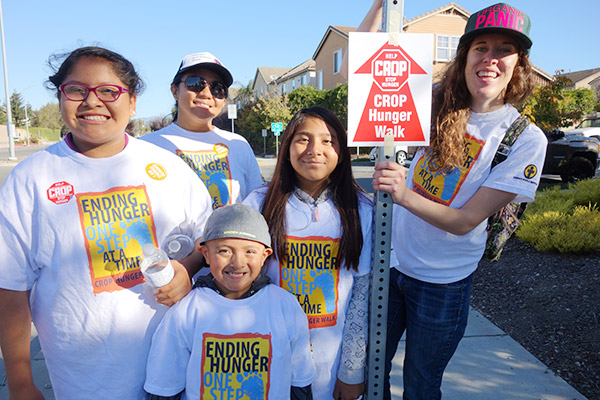 five people wearing crop walk shirts